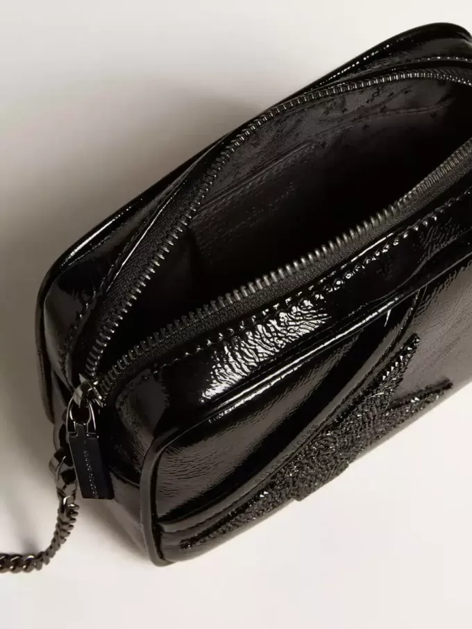 Bolso Mini Star en piel negra con estrella de cristal Swarovski Bolso Mini Star en piel negra con estrella de cristal Swarovski