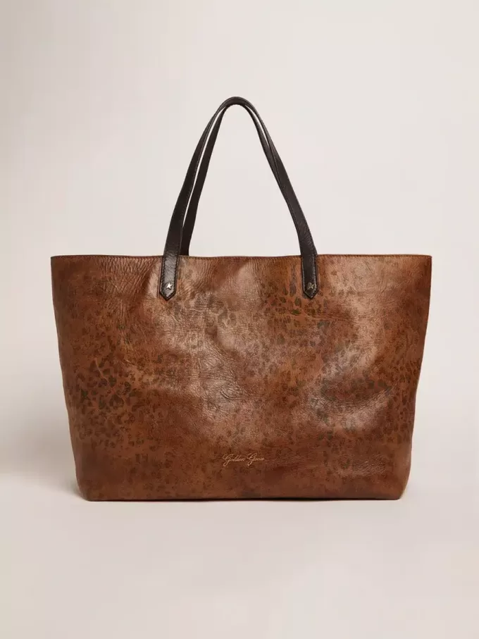 Bolso Pasadena en piel martillada con estampado de leopardo y asas negras a contraste