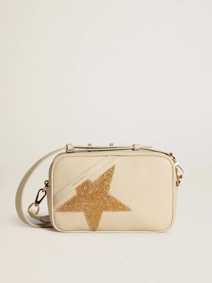 Bolso Star en piel martillada color mantequilla con estrella de cristal Swarovski