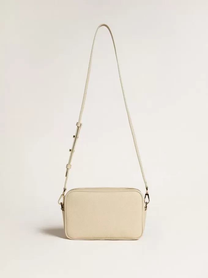 Bolso Star en piel martillada color mantequilla con estrella de cristal Swarovski