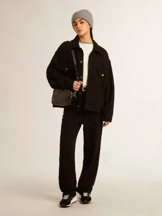 Bolso Star en piel negra brillante con estrella tono sobre tono