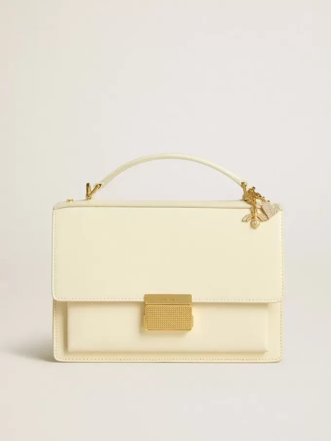 Bolso Venezia en piel acolchada color mantequilla con doble charm Bolso Venezia en piel acolchada color mantequilla con doble charm