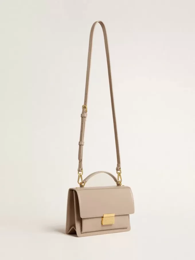 Bolso Venezia en piel beige con ribetes y detalles dorados
