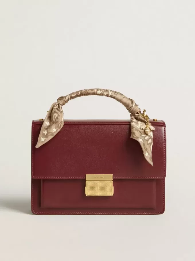 Bolso Venezia en piel bordada burdeos con detalles dorados Bolso Venezia en piel bordada burdeos con detalles dorados