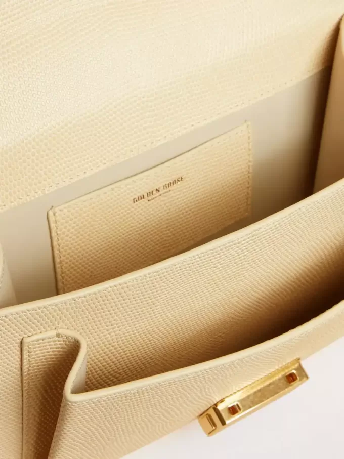 Bolso Venezia en piel con estampado pitón beige y detalles dorados.