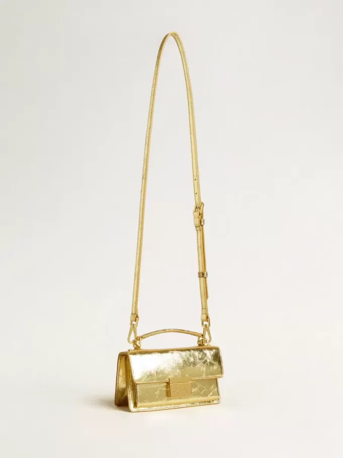 Bolso Venezia pequeño en piel metalizada dorada con detalles dorados.