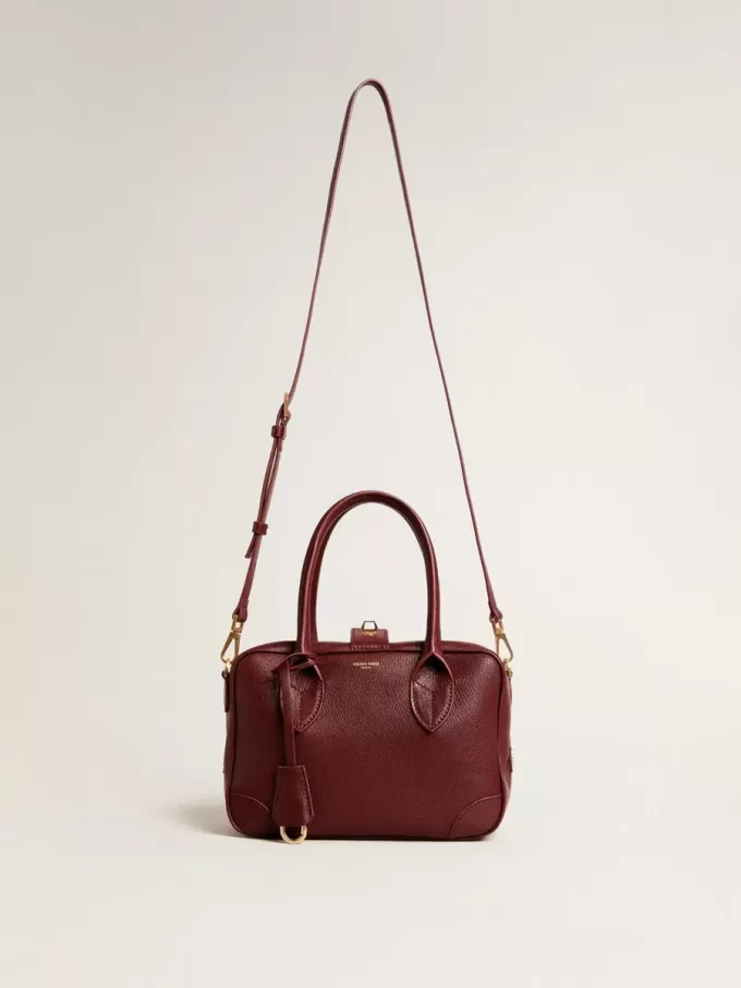Bolso Vita en piel burdeos con detalles dorados