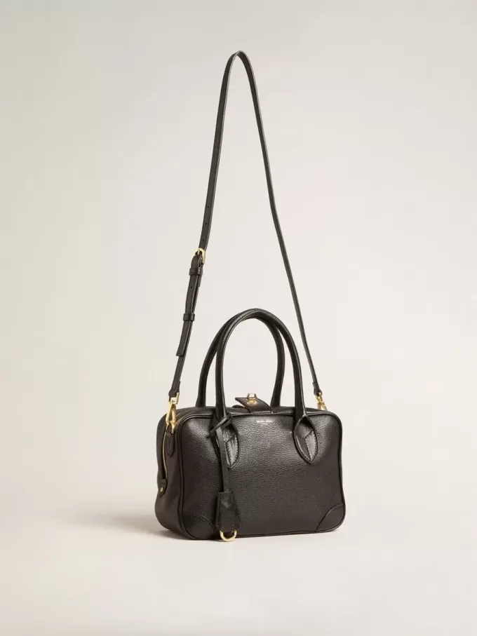 Bolso Vita en piel de oveja negra con detalles dorados