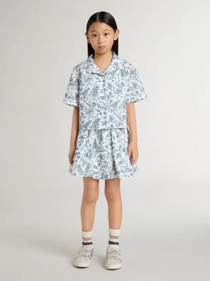 Camisa corta blanca para niña con estampado azul Camisa corta blanca para niña con estampado azul