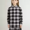 Camisa infantil a cuadros blancos y negros con bordados blancos
