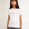 Camiseta blanca con letras doradas en cristales en el centro