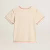 Camiseta crema para mujer con detalles en rojo descolorido