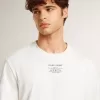 Camiseta de algodón blanco desgastado para hombre con letras negras