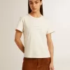 Camiseta de algodón blanco envejecido para mujer con estampado y bordado Camiseta de algodón blanco envejecido para mujer con estampado y bordado