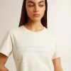 Camiseta de algodón blanco envejecido para mujer con estampado y bordado Camiseta de algodón blanco envejecido para mujer con estampado y bordado