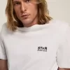 Camiseta de la colección White Star con logotipo y estrella negros en contraste