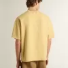 Camiseta oversize de algodón amarilla con estampado azul para hombre