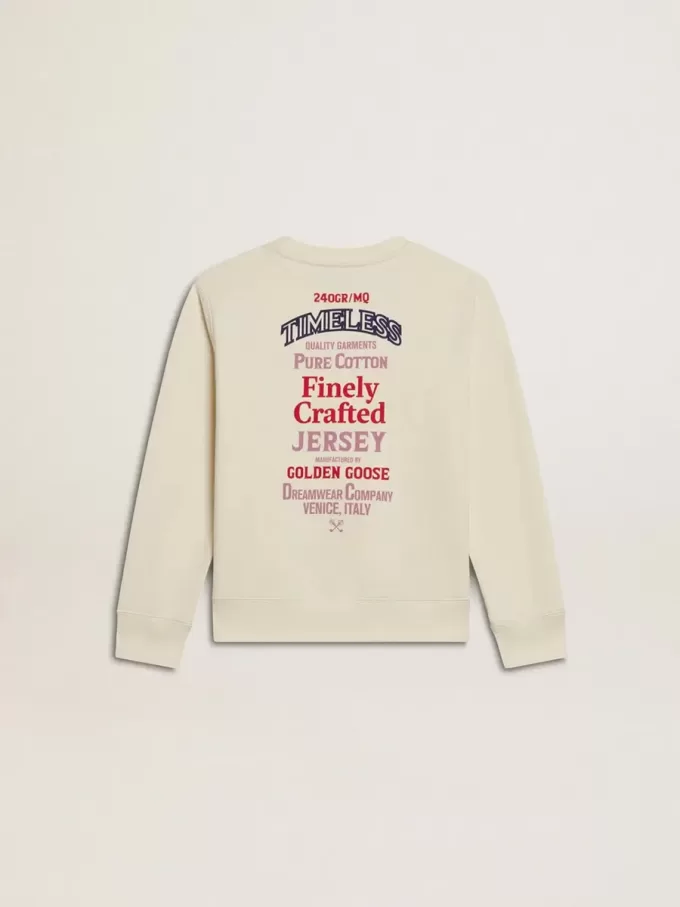 Camiseta para niña en blanco desgastado con bordado en la parte delantera y estampado en la espalda