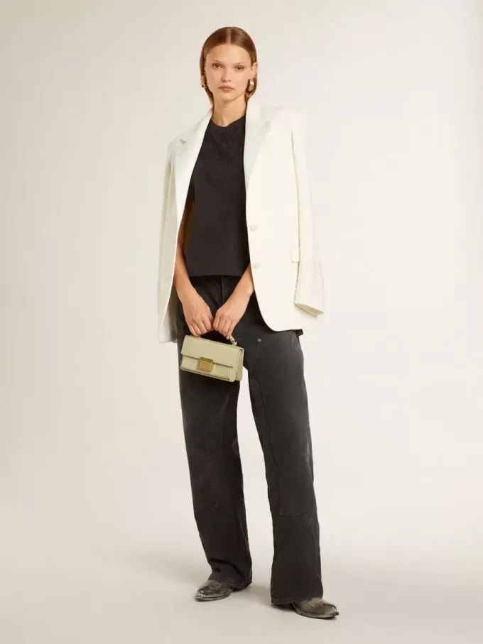 Camiseta sin mangas en negro desgastado con bordado degradado tono sobre tono.