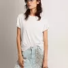 Camiseta slim fit para mujer en blanco con efecto desgastado