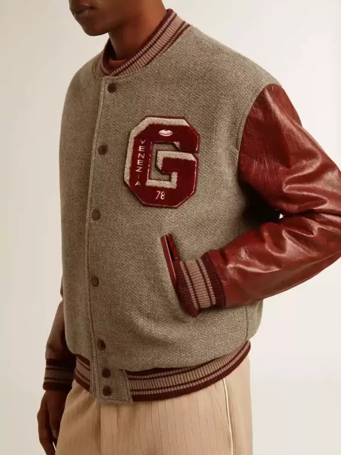 Cazadora bomber de lana gris jaspeada con mangas de cuero