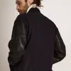 Cazadora bomber para hombre en lana azul oscuro con mangas de cuero
