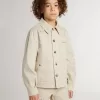 Chaqueta beige para niño con salpicaduras multicolores Chaqueta beige para niño con salpicaduras multicolores