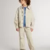 Chaqueta beige para niño con salpicaduras multicolores Chaqueta beige para niño con salpicaduras multicolores