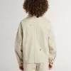 Chaqueta beige para niño con salpicaduras multicolores Chaqueta beige para niño con salpicaduras multicolores