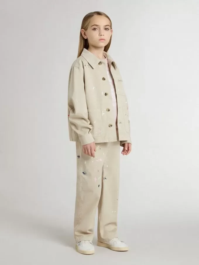 Chaqueta beige para niño con salpicaduras multicolores Chaqueta beige para niño con salpicaduras multicolores