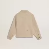 Chaqueta beige para niño con salpicaduras multicolores Chaqueta beige para niño con salpicaduras multicolores
