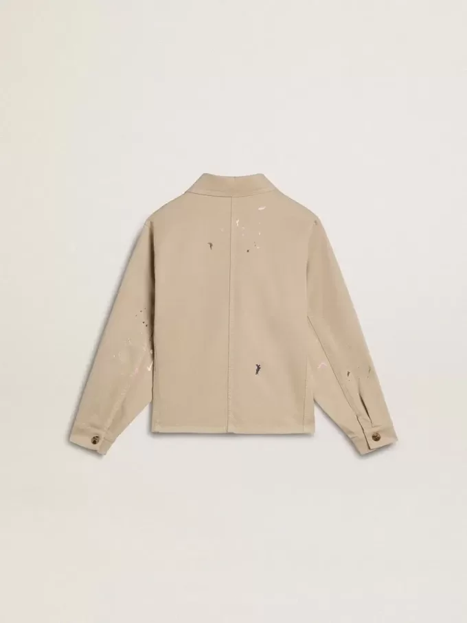 Chaqueta beige para niño con salpicaduras multicolores Chaqueta beige para niño con salpicaduras multicolores