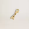 Charm con la letra A en latón dorado con cristales