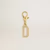Charm con la letra D en latón dorado con cristales