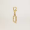 Charm con la letra Q en latón dorado con cristales