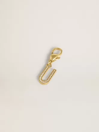 Charm con la letra U en latón dorado con cristales