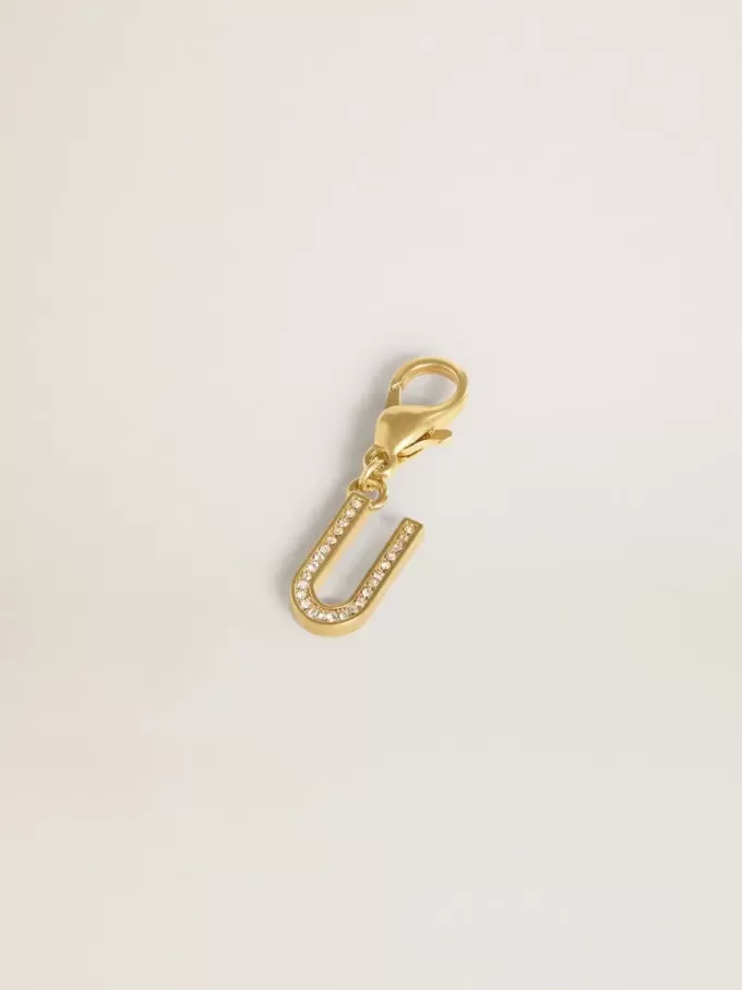 Charm con la letra U en latón dorado con cristales