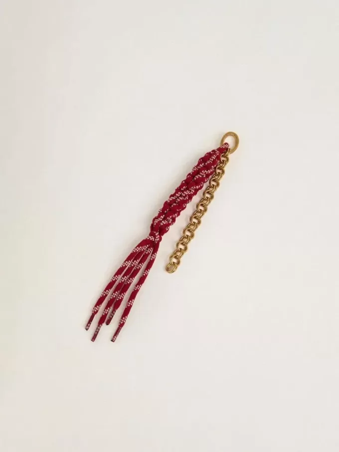 Colgante con cordones rojos anudados Colgante con cordones rojos anudados