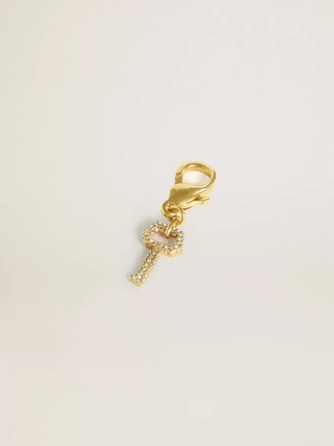 Colgante con forma de llave en latón dorado con cristales
