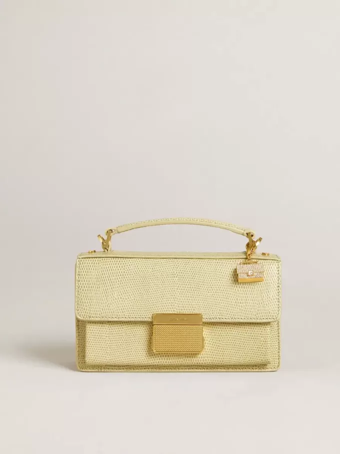 Colgante con forma de monedero en latón dorado con cristales