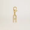 Colgante con letra H en latón dorado con cristales Colgante con letra H en latón dorado con cristales