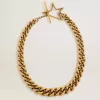 Collar con cadena decreciente en oro antiguo y cierre en forma de estrella Collar con cadena decreciente en oro antiguo y cierre en forma de estrella