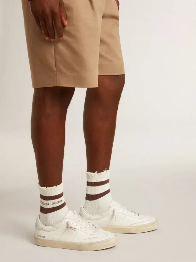 Cárdigan blanco de algodón para hombre con diseño de trenzado y ribetes azules Cárdigan blanco de algodón para hombre con diseño de trenzado y ribetes azules