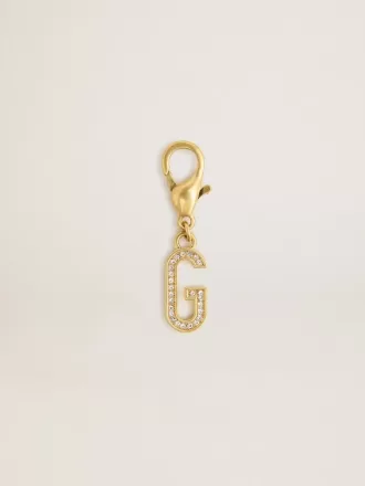 Dije con la letra G en latón dorado con cristales