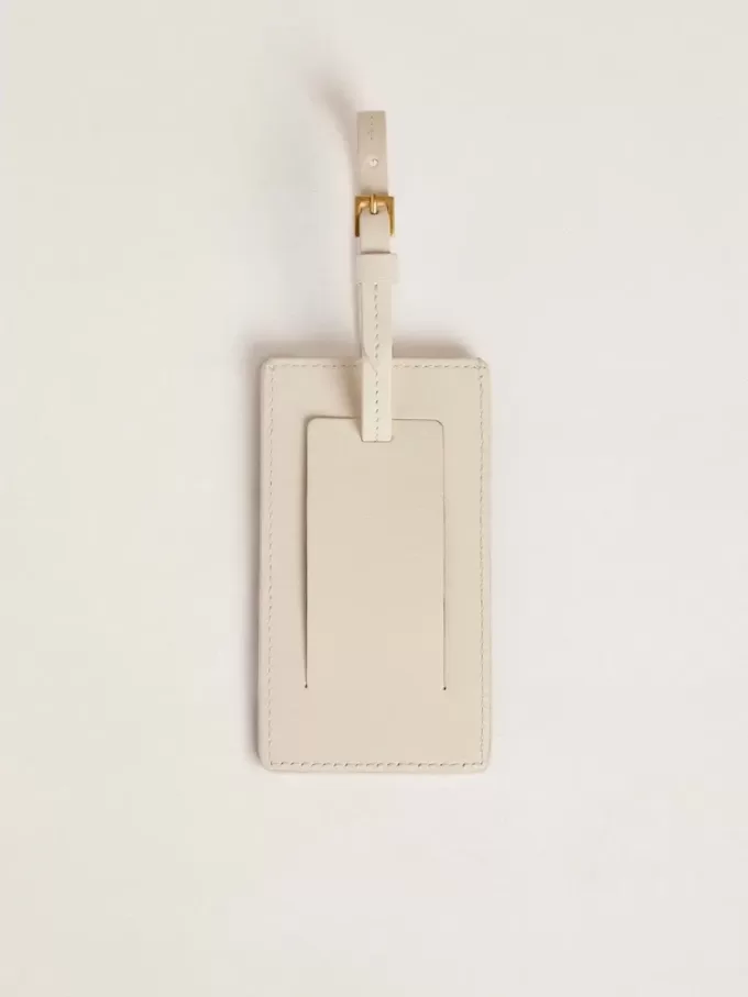 Etiqueta de equipaje blanca desgastada Etiqueta de equipaje blanca desgastada