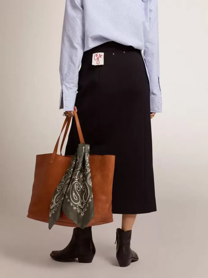 Falda lápiz de mujer en lana azul oscuro con botones heráldicos dorados