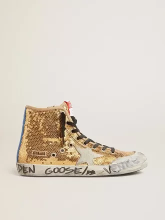 Francy Penstar en lentejuelas doradas con estrella de ante y lengüeta azul brillante en el talón