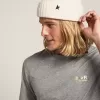 Gorro de lana blanco con estrella negra