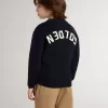 Jersey azul de cuello redondo para niño con las letras «Golden» en la espalda. Jersey azul de cuello redondo para niño con las letras «Golden» en la espalda.