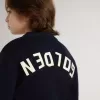 Jersey azul de cuello redondo para niño con las letras «Golden» en la espalda. Jersey azul de cuello redondo para niño con las letras «Golden» en la espalda.